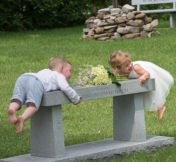 wedding candid of kids on bench