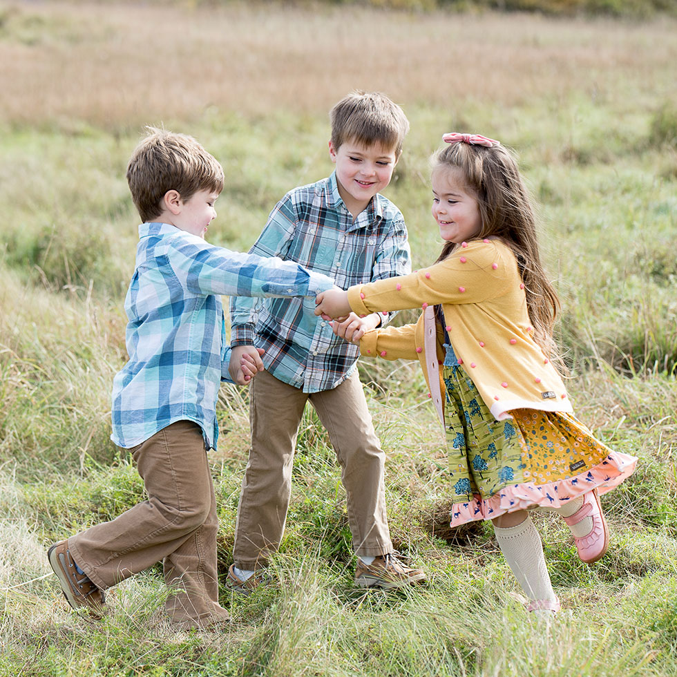 siblings playing portrait