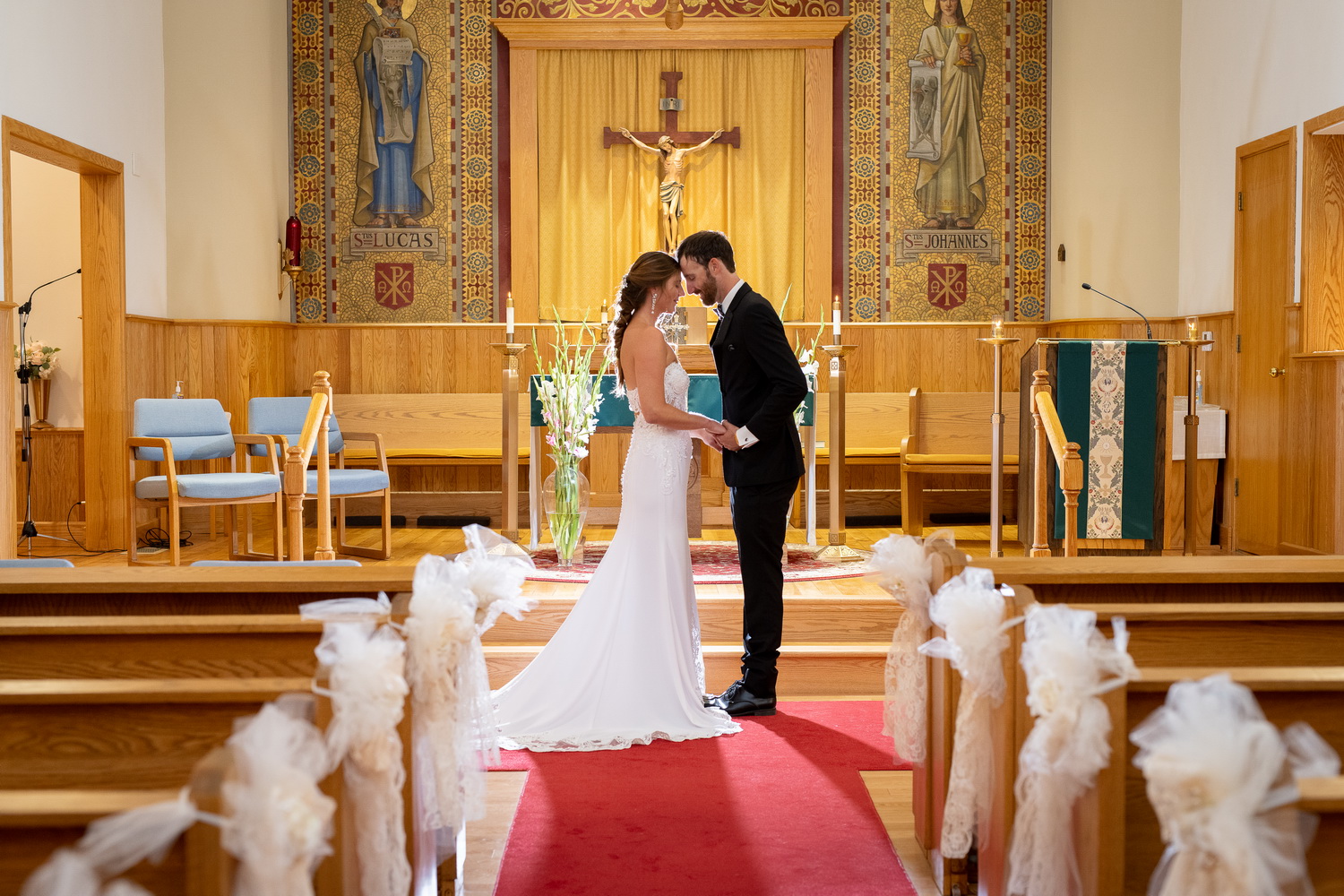 Backlit altar kiss touching