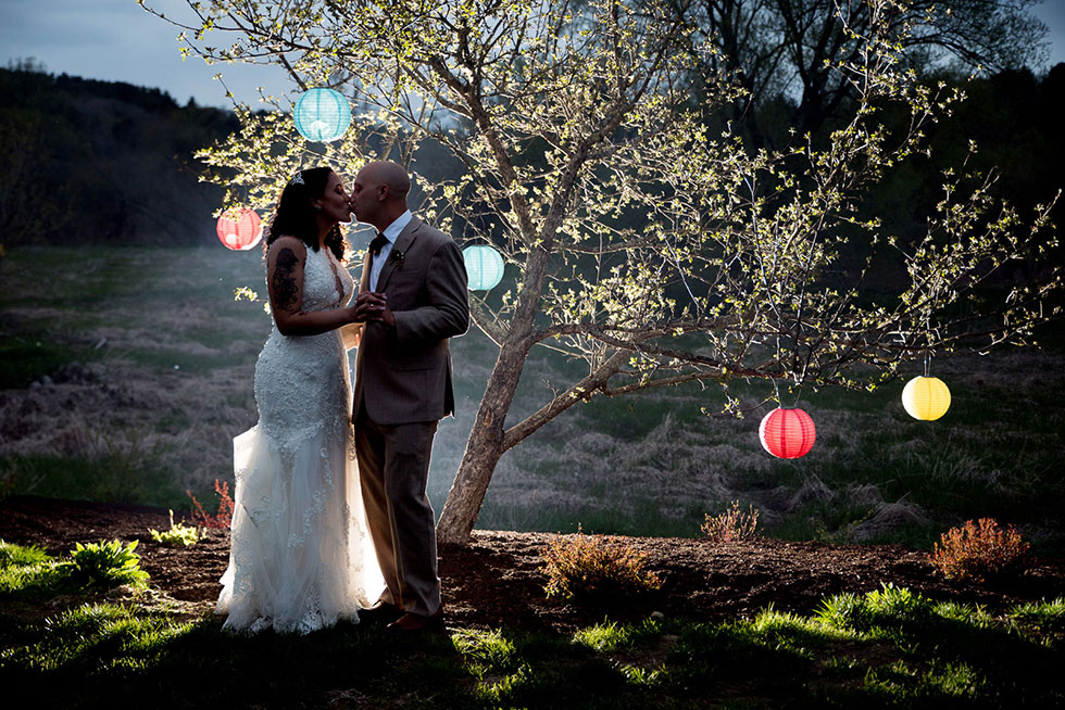 couple under tree lights