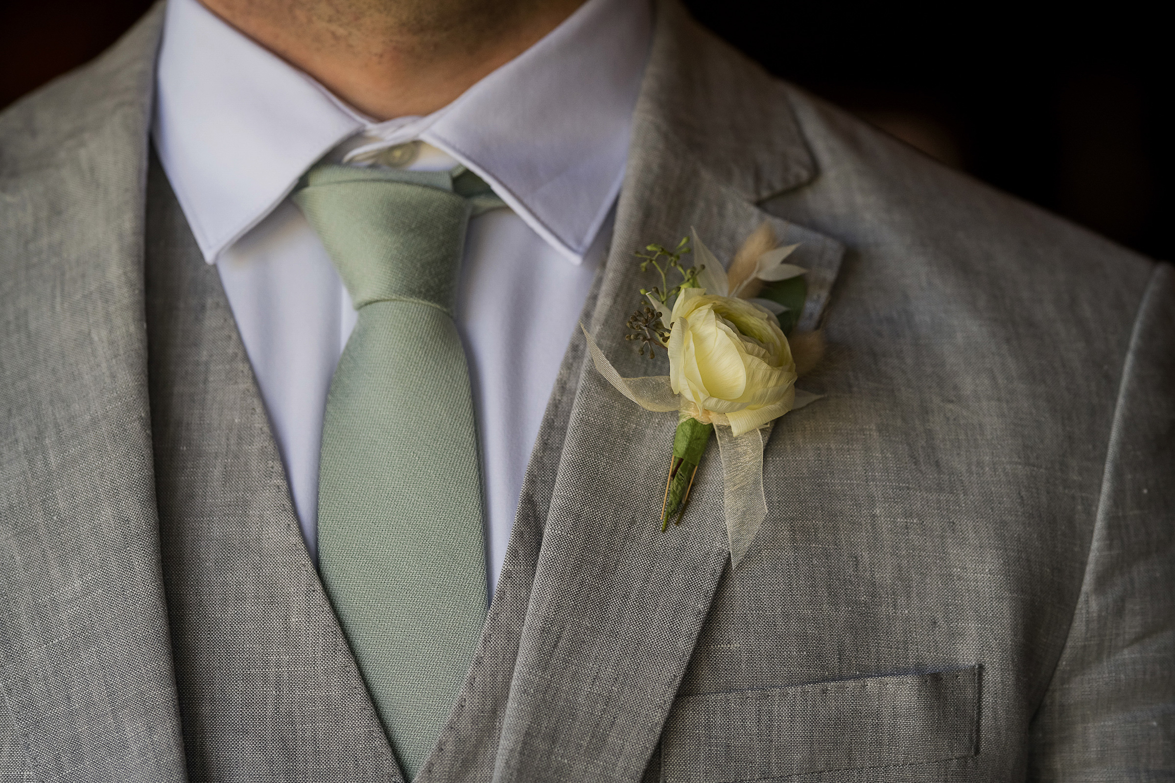 grooms boutonniere on suit