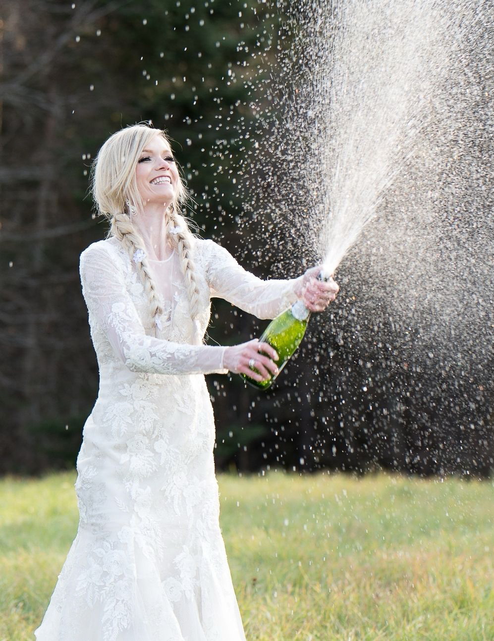 bride spraying champagne