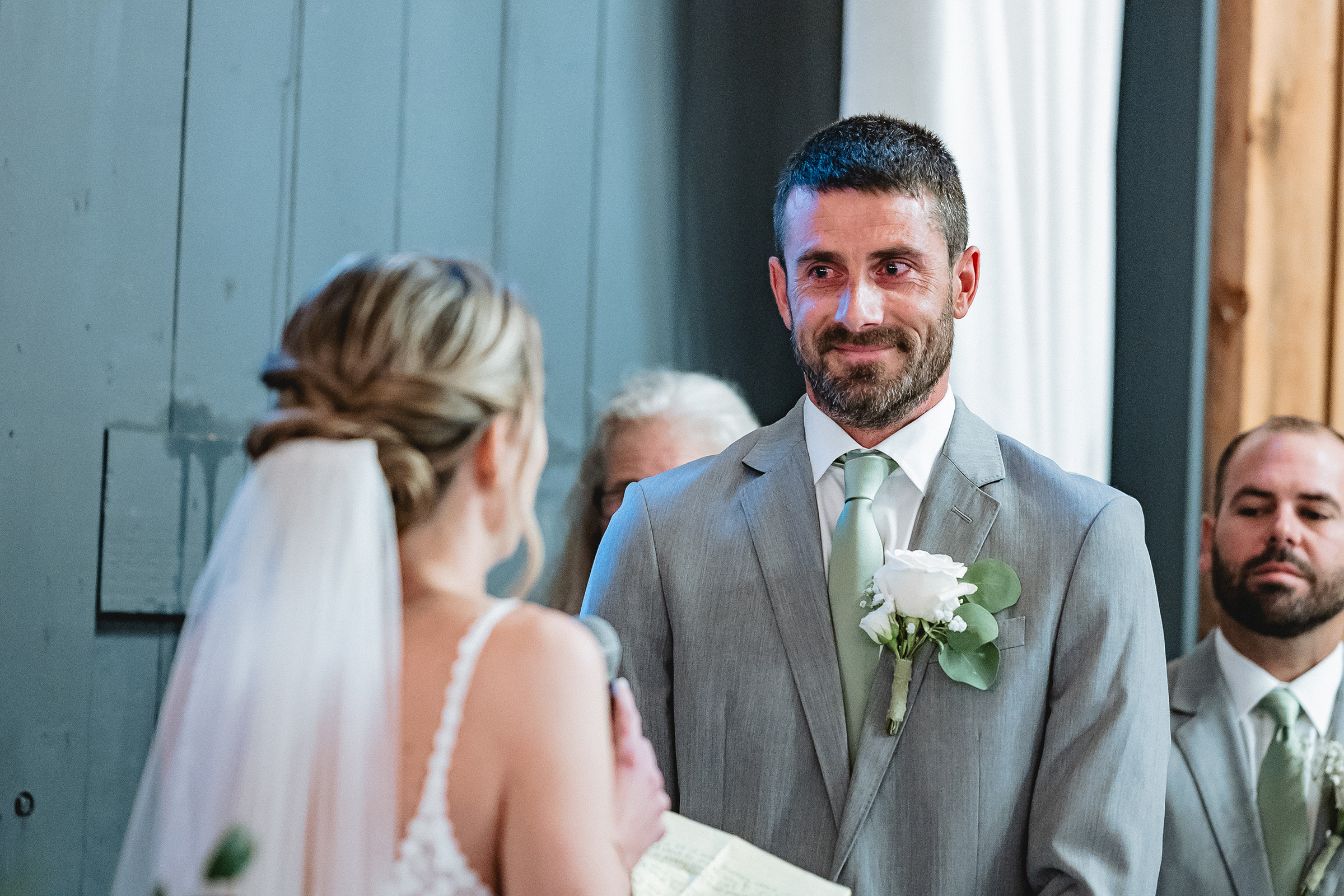 groom looking at bride
