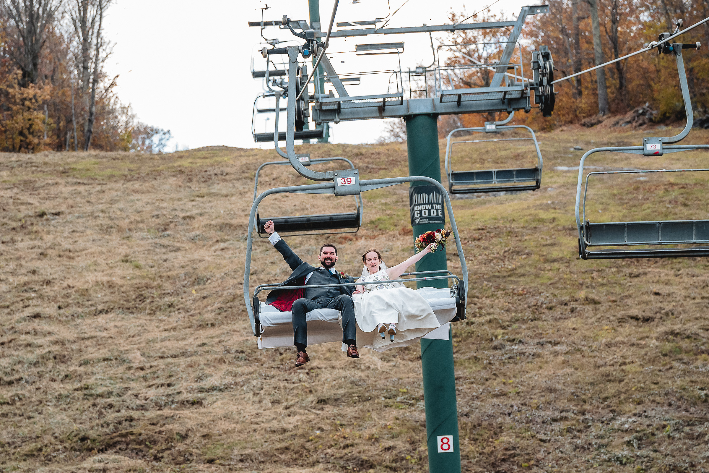 bride and groom on chairlift